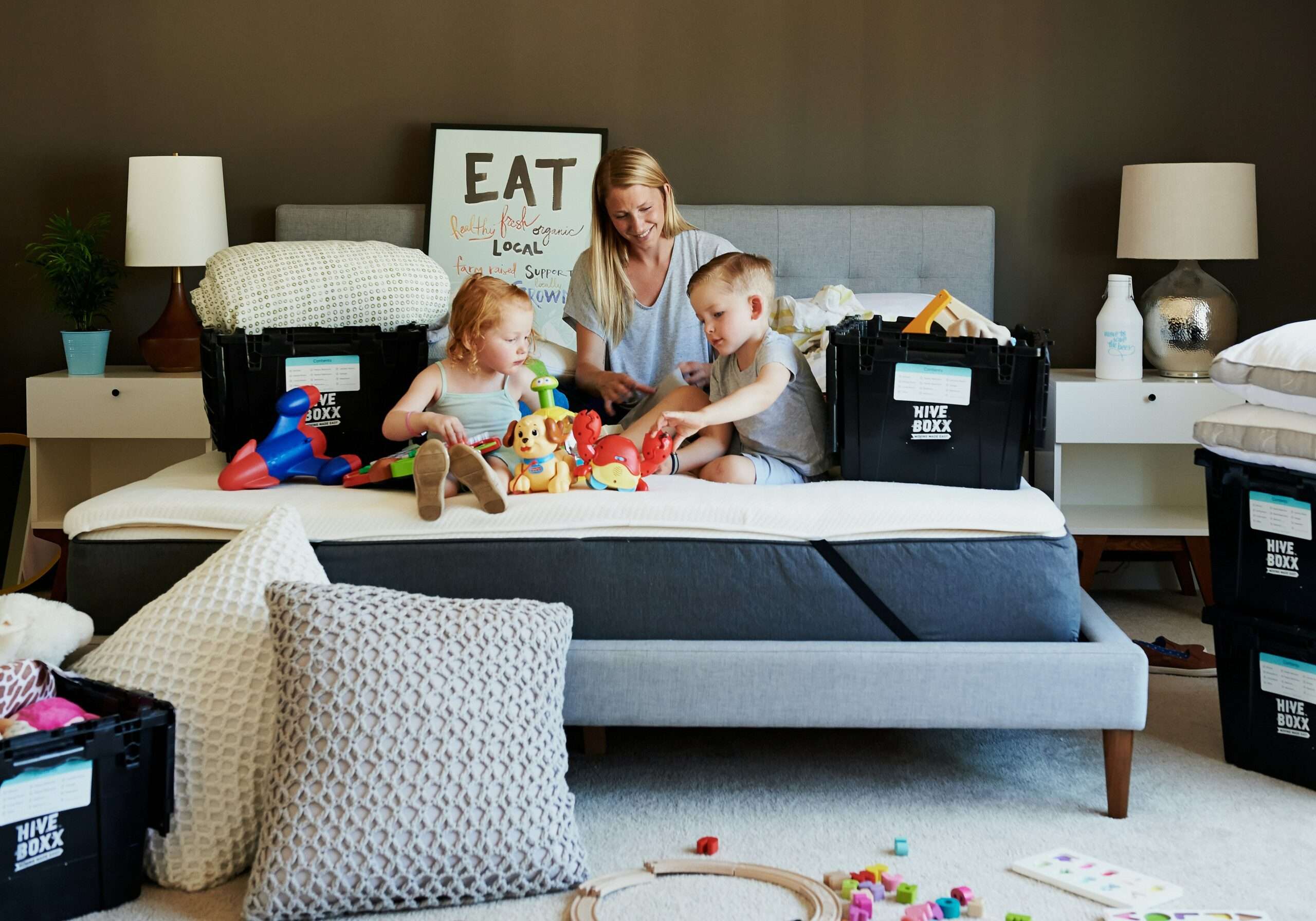 Family packing with moving boxes for professional packing services in Fargo-Moorhead